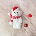 White plush teddy bear with a red Christmas hat and scarf on a soft mesh background - White Bear With Red White Scarf