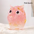 Pink rose quartz owl figurine with gold leaf accents on a white decorative stone - Rose Quartz Style 2