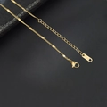 Close-up of golden stainless steel necklace with adjustable extension chain and lobster clasp - 1.5mm Flat Spaced Curb Chain / 40+5CM Extension Chain / Gold