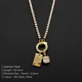 Elegant stainless steel initial S necklace with square CZ pendant in 14K gold plated finish - Letter S (XNL0116)