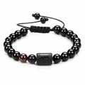 Close-up of black obsidian zodiac bracelet with Aquarius symbol and adjustable cord - Aquarius