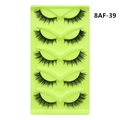 Detail view of 5 pairs of dense fox-eye faux mink eyelashes on a green holder - Feather Cross Style (8AF-39)