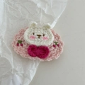 Detailed shot of handmade crochet bunny hair clip with cherry embroidery and pink bow - Crochet-Pink Rabbit