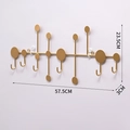 Golden wall-mounted coat rack with 7 J-hooks and geometric accents, 57.5cm width - Gold Large Round Hook