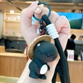 Black dinosaur keychain with woven strap and straw hat charm for bag decoration - Resin Straw Hat Dinosaur-Black