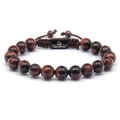 Detailed macro view of 10mm tiger eye beads with adjustable brown braided cord strap - Red Tiger Eye Bracelet
