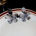 Detail of grey marble acrylic flower earrings on a textured ceramic display plate - Marble Pattern Acrylic Flower Style (Silver Earring Post)