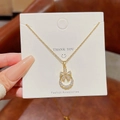Golden necklace with circular floral pendant paved in white zircon on white display card - X610 Gold Flower Circle Full Rhinestone