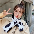 Close-up of fluffy cow pattern faux fur scarf showing soft texture and thick warm material - Big Spotted Cow