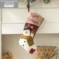 Burgundy Christmas stocking featuring a snowman patchwork hanging on a fireplace mantel - Wine Red Snowman Style (AGWZ14-9)
