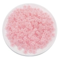 DIY translucent pink star acrylic beads displayed in a white round tray for jewelry making - Frosted Pink Star