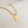 Detailed close-up of a 18K gold plated rectangular pendant featuring engraved letter N - Letter N