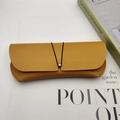 Portable bright yellow pebble grain leather sunglasses pouch with elastic bead closure - Khaki/Earth Yellow