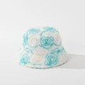 Detail shot of 3D blue and white plush roses on a textured winter bucket hat for women - M (56-58cm) / Blue