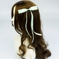 Elegant mint green polyester ribbon bow hair clip with long streamers on brown hair - Azure Blue