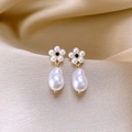 Detail of gold floral pearl earrings with black center on champagne silk background - French Camellia Pearl Rhinestone Stud Earrings (1#)