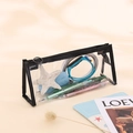 Transparent PVC pencil case with black trim and circular zipper in triangular design - Black
