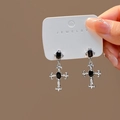 Detailed view of silver cross earrings with black gemstone inlays and white zircons - Silver Cross Black Gem Dangle