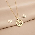 Close-up of golden geometric necklace and earrings set with butterfly motif in circles - Circle Frame Butterfly Style