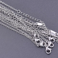 Detail of 304 stainless steel cross chains with lobster clasps and extension links - 1.5mm / Silver