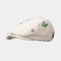 Dettaglio della texture del berretto in velluto a coste con ricamo floreale viola e paillettes - Taglia unica / Beige