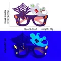 Halloween purple ghost party glasses with BOO text and neon effect under UV light - Spider Web Ghost Style