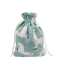 Detailed macro view of cyan linen drawstring pouch featuring a white alpaca pattern - 13*18cm / Alpaca