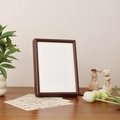 Dark walnut wood photo frame with white matting displayed on a wooden desk - 6 Inch / Walnut