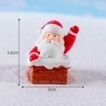 Miniature resin Santa Claus figurine in chimney variant with snow scene background - No.6 Santa Claus in Chimney