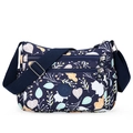 Dark blue nylon crossbody bag with leaf floral print and multiple zip pockets - Blue Background Leaves
