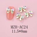 Detailed view of 11.5x8mm golden bow nail charms with heart-shaped iridescent rhinestones - Gold Base Pink Green Gradient (AC24)