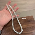 Classic 8mm round white pearl necklace with adjustable gold-tone clasp and chain - 8MM Pearl Necklace (Titanium Steel Non-Fading)