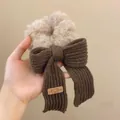 Plush beige faux shearling scrunchie with a dark brown knit bow and bear tag - Khaki Bow Scrunchie