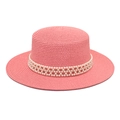 Close-up of pink flat top straw hat featuring triple row pearl band decoration - Pink