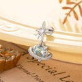 Orecchino a stella con gemma azzurra e alone di pavé in finitura argento lucido - Azzurro