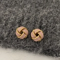 Detail of vintage French knot earrings with pink enamel and gold plated finish - Pink Concentric Knot - Gold Plated