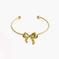 Polished golden stainless steel open bangle with minimalist elegant bow design - Gold Color Bracelet