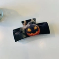 Halloween claw clip featuring spooky Jack-o'-lantern pumpkin and smoke pattern on black resin - Pumpkin Head Claw Clip