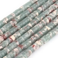 Macro shot of cylindrical natural stone beads in green and reddish brown for DIY jewelry - Shoushan Stone Pattern