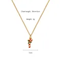 Close-up of candy cane pendant with holly leaf on a 39cm gold titanium steel chain - Candy Cane