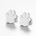 Macro view of polished silver paw print stud earrings with butterfly backings - 104 Paw - Silver