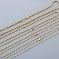 Vista macro di varie dimensioni di collane a sfere in acciaio inossidabile placcato oro 18K - 1.3mm / 45cm / Oro