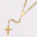 Macro shot of gold stainless steel rosary necklace with beads and crucifix pendant - Gold
