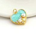Macro detail of heart-shaped gold pendant with blue enamel, pearls, and zircons - 10-Heart Shape Light Blue Marble Pearl