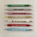 Detailed set of 7 glitter Christmas ballpoint pens with weekday holiday phrases - Christmas Theme 7-Piece Set