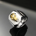 Macro shot of two-tone silver and gold skull ring for men with sharp metallic reflection - US 12 / Gold & Silver