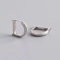 Close-up of S925 sterling silver stamp on zircon-studded D-letter shaped hoop earrings - 925 Silver / White Gold