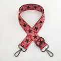 Close-up of pink star pattern wide shoulder strap with gunmetal swivel hooks - Pink Base Coffee Star Gunmetal Buckle