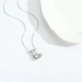 Polished silver 3D balloon initial E pendant necklace on a fine minimalist link chain - Letter E