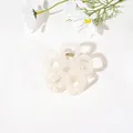 Detail of cream white flower hair claw clip with golden spring on white background - Hollow Five-Petal Flower - Jelly Cream